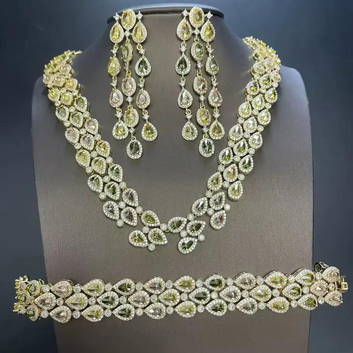 Ensemble collier, bracelet et boucles d'oreilles en forme de goutte d'eau pour femme, entièrement serti de zircon