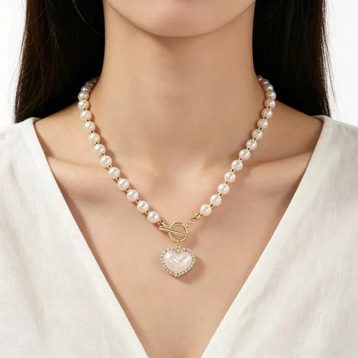 Collier élégant en perles d'imitation pour femmes, chaîne de luxe en perles d'imitation, chaîne de clavicule, bijoux à breloques