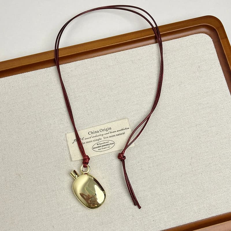 Collier avec pendentif bouilloire en métal pour femmes, bijoux modernes, tempérament élégant, nouvea
