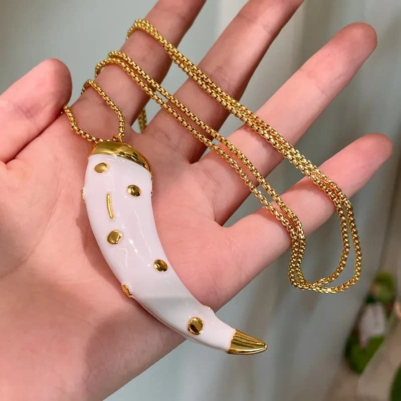 Collier pendentif corne double face