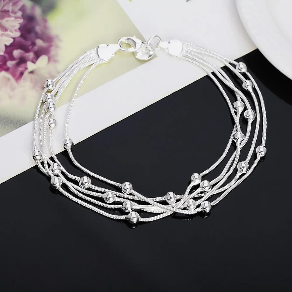 Bracelet élégant en argent 925 avec breloques et perles