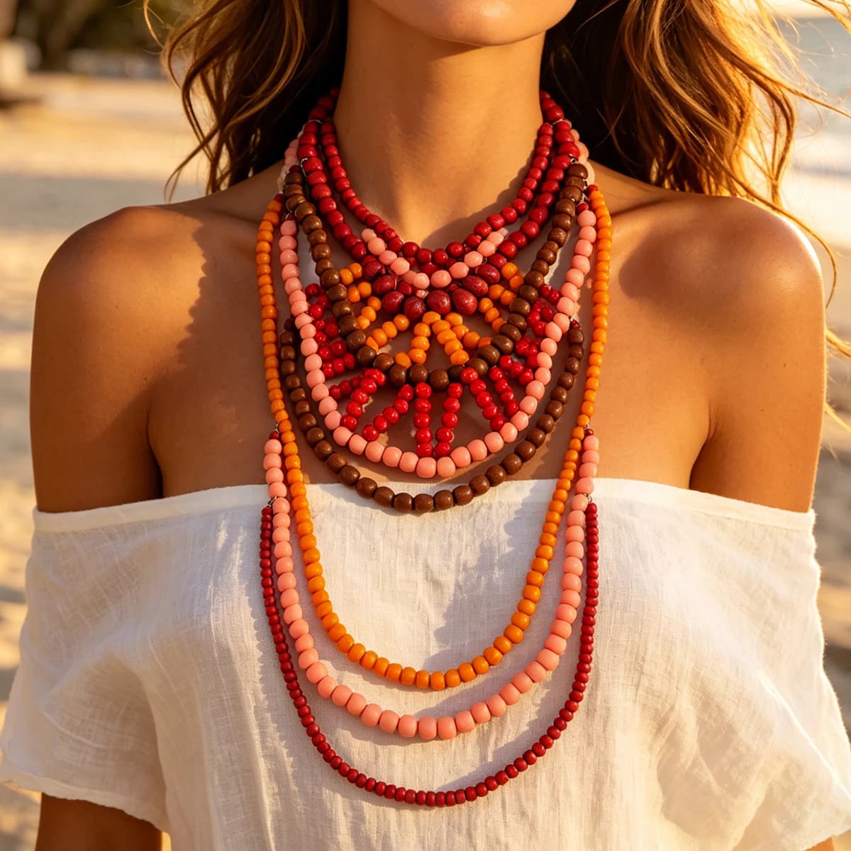 Collier bib bohème multicouche en perles de bois, dégradé rouge-orange-brun, bijou tendance pour femme, idéal pour les vacances à la plage - Collection été 2026