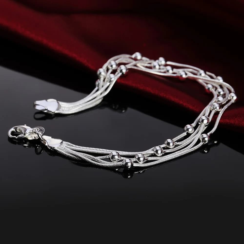 Bracelet élégant en argent 925 avec breloques et perles