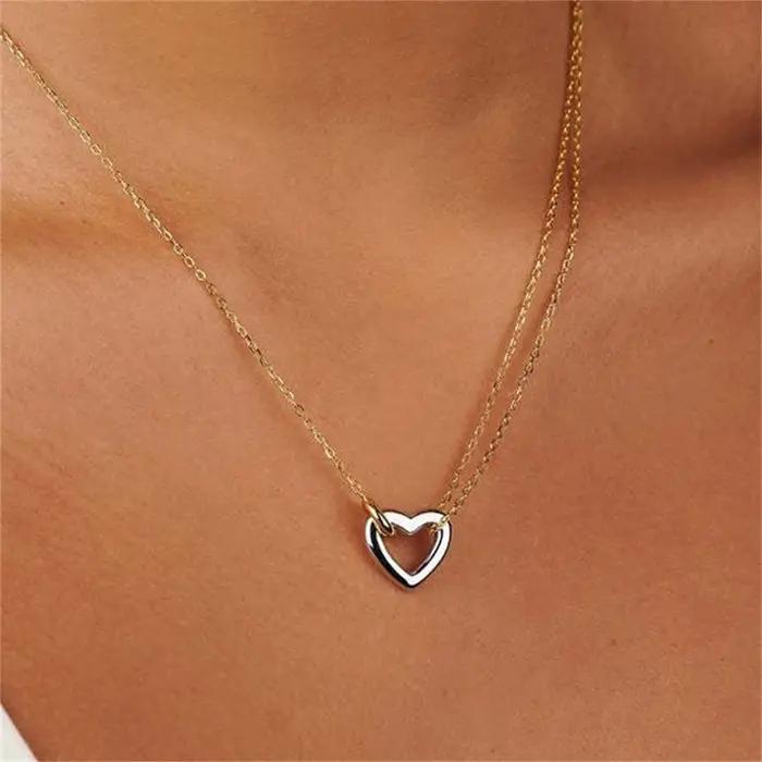 Collier avec pendentif cœur en acier inoxydable couleur or jaune clair avec pierres précieuses artificielles pour femme style mode élégant