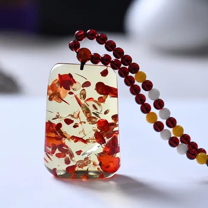 Collier avec pendentif en ambre à fleurs fines pour homme et femme