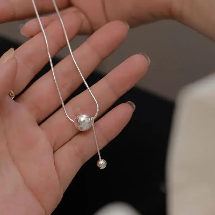 Pendentif boule dorée Simple