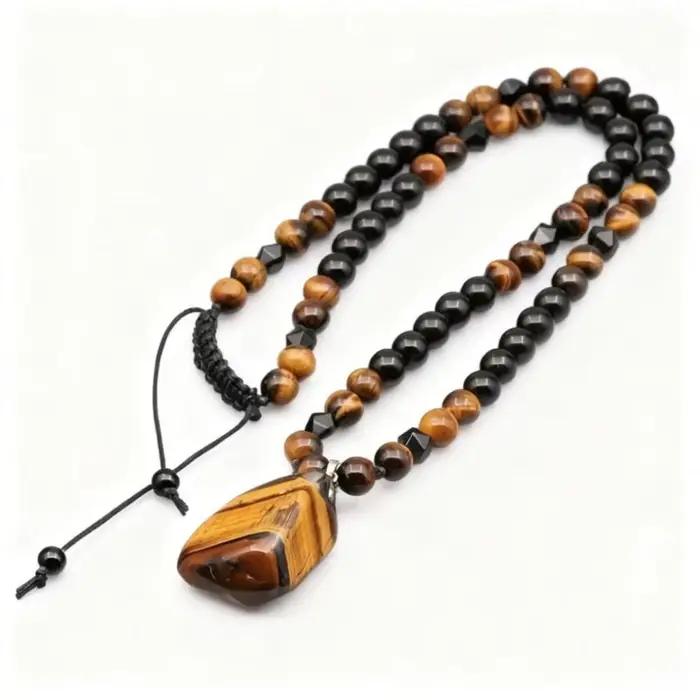 Collier en pierre d'oeil de tigre pendentif en perles noires pour femmes classique et audacieux pour anniversaire et occasions spéciales